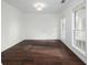 Formal dining room with hardwood floors and large windows at 3012 Lexington Ave, Woodstock, GA 30189