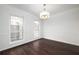 Spacious dining room with hardwood floors and crown molding at 3012 Lexington Ave, Woodstock, GA 30189