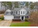 Two-story house with gray roof, white siding, and black shutters at 3012 Lexington Ave, Woodstock, GA 30189