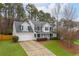 Two-story house with gray roof, white siding, and black shutters at 3012 Lexington Ave, Woodstock, GA 30189