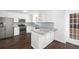 Updated kitchen boasts granite countertops and stainless steel appliances at 3012 Lexington Ave, Woodstock, GA 30189