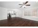 Bright living room features hardwood floors and sliding glass doors leading to backyard at 3012 Lexington Ave, Woodstock, GA 30189