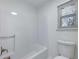 Clean bathroom with a bathtub, toilet and shower at 4925 Erin Rd, Atlanta, GA 30331