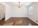 Bright dining room with hardwood floors and modern chandelier at 4925 Erin Rd, Atlanta, GA 30331