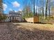 Backyard view showing house and storage building at 4925 Erin Rd, Atlanta, GA 30331