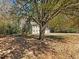 Two story house with mature trees and a large yard at 4925 Erin Rd, Atlanta, GA 30331