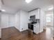 Bright kitchen with white cabinets, stainless steel appliances, and hardwood floors at 4925 Erin Rd, Atlanta, GA 30331