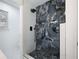 Large walk-in shower with marble tile and rain shower head at 4925 Erin Rd, Atlanta, GA 30331