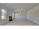 Bright living room with hardwood floors and a fireplace at 225 Chiswick Loop, Stockbridge, GA 30281