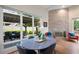 Bright dining area with view to backyard, stone accent wall and hardwood floors at 4225 Maner Se St, Smyrna, GA 30080