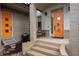 Modern home with a stylish orange front door and brick facade at 4225 Maner Se St, Smyrna, GA 30080