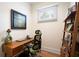 Home office with built-in shelving and hardwood floors at 4225 Maner Se St, Smyrna, GA 30080