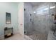 Large walk-in shower with marble tile and built-in shelving at 4225 Maner Se St, Smyrna, GA 30080