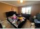 Bedroom with a queen bed and neutral colored walls at 5993 Springfair Run, Lithonia, GA 30038