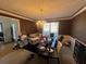 Formal dining room with dark walls and a chandelier at 5993 Springfair Run, Lithonia, GA 30038