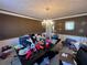 Formal dining room with a dark wood table and chandelier at 5993 Springfair Run, Lithonia, GA 30038