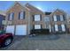 Brick two-story house with a two-car garage and a basketball goal at 5993 Springfair Run, Lithonia, GA 30038