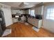 Galley-style kitchen with hardwood floors and white cabinets at 5993 Springfair Run, Lithonia, GA 30038