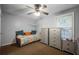 Bright bedroom with a daybed, dresser, and ceiling fan at 6711 Witherington Ct, Norcross, GA 30093