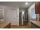 Modern kitchen with stainless steel refrigerator and tile flooring at 6711 Witherington Ct, Norcross, GA 30093