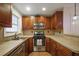 Galley kitchen boasts stainless steel appliances and ample counter space at 6711 Witherington Ct, Norcross, GA 30093