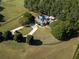 Aerial view of house, pool, and large lot at 75 Rivercreek Xing, Kingston, GA 30145