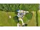 Aerial view of a beautiful home with a long driveway and well-manicured lawn at 75 Rivercreek Xing, Kingston, GA 30145