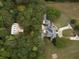 Aerial view of house, barn, and surrounding landscape at 75 Rivercreek Xing, Kingston, GA 30145