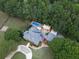 Stunning aerial view of estate with a swimming pool, fenced garden, lush landscaping, and a large private backyard at 75 Rivercreek Xing, Kingston, GA 30145