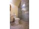 Marble tiled bathroom with a walk in shower and ornate mirror at 75 Rivercreek Xing, Kingston, GA 30145