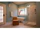 Bathroom features a tub under a stained glass window and large walk in shower at 75 Rivercreek Xing, Kingston, GA 30145