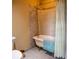 Bathroom boasts a classic clawfoot tub and vintage brass fixtures at 75 Rivercreek Xing, Kingston, GA 30145