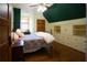 Bedroom with built-in shelving and a charming quilt bed at 75 Rivercreek Xing, Kingston, GA 30145