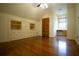 Spacious bedroom with hardwood floors, built in shelves and desk and a ceiling fan at 75 Rivercreek Xing, Kingston, GA 30145