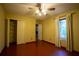 Bright bedroom featuring a ceiling fan, closet, and window with natural light at 75 Rivercreek Xing, Kingston, GA 30145