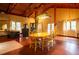 Spacious dining room with wood floors, exposed beams, and ample natural light at 75 Rivercreek Xing, Kingston, GA 30145