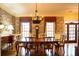 Formal dining room with floral wallpaper and chandelier at 75 Rivercreek Xing, Kingston, GA 30145