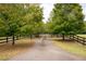 Long driveway leading to a gated estate at 75 Rivercreek Xing, Kingston, GA 30145