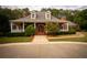 Grand brick home with a covered porch and manicured landscaping at 75 Rivercreek Xing, Kingston, GA 30145