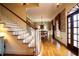 Grand foyer with hardwood floors, staircase, and traditional décor at 75 Rivercreek Xing, Kingston, GA 30145