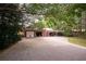Spacious detached garage with a covered carport, perfect for multiple vehicles and storage at 75 Rivercreek Xing, Kingston, GA 30145