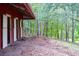 Exterior of barn with several stalls and wooded backdrop at 75 Rivercreek Xing, Kingston, GA 30145