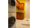 Cozy laundry room features stacked washer/dryer and tiled shower stall at 75 Rivercreek Xing, Kingston, GA 30145