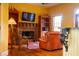 Cozy living room featuring a fireplace, built-in bookshelves, and comfortable seating at 75 Rivercreek Xing, Kingston, GA 30145