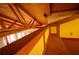 Upper loft area showcasing exposed wooden beams and unique architectural details at 75 Rivercreek Xing, Kingston, GA 30145