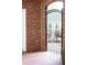 Wrought iron gate leading from a brick patio to the exterior with landscaped gardens and wooded areas at 75 Rivercreek Xing, Kingston, GA 30145