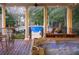 Porch view of a backyard oasis featuring a pool with water features and a hot tub for ultimate relaxation at 75 Rivercreek Xing, Kingston, GA 30145