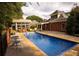 Large in-ground swimming pool with a gazebo and outdoor seating in a beautiful backyard at 75 Rivercreek Xing, Kingston, GA 30145