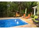 Relaxing pool with patio furniture and water features at 75 Rivercreek Xing, Kingston, GA 30145