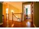 Upstairs hallway with hardwood floors and access to bedrooms at 75 Rivercreek Xing, Kingston, GA 30145